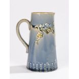 Royal Doulton jug, the pale blue ground with raised blossoming branch and bird decoration, 17.5cm
