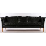 Black leatherette upholstered three seat settee, on square light wood legs