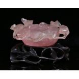 Rose quartz carving in the form of a bowl with pierced leaf decorated border, on a pierced carved