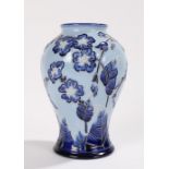 Moorcroft Tazella pattern vase, of bulbous form, with blue foliate decoration on a sky blue