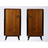 Pair of mid 20th century walnut veneered bedside cupboards, the cupboard doors with pierced