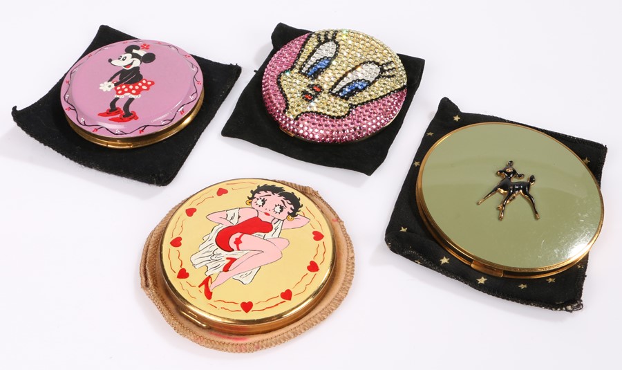 Collection of four compacts featuring cartoon characters: a 'Madeline Beth' compact of 'Tweety