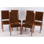 Six G-plan dining chairs, with brown upholstered backs and seats, show wood frames, on chamfered