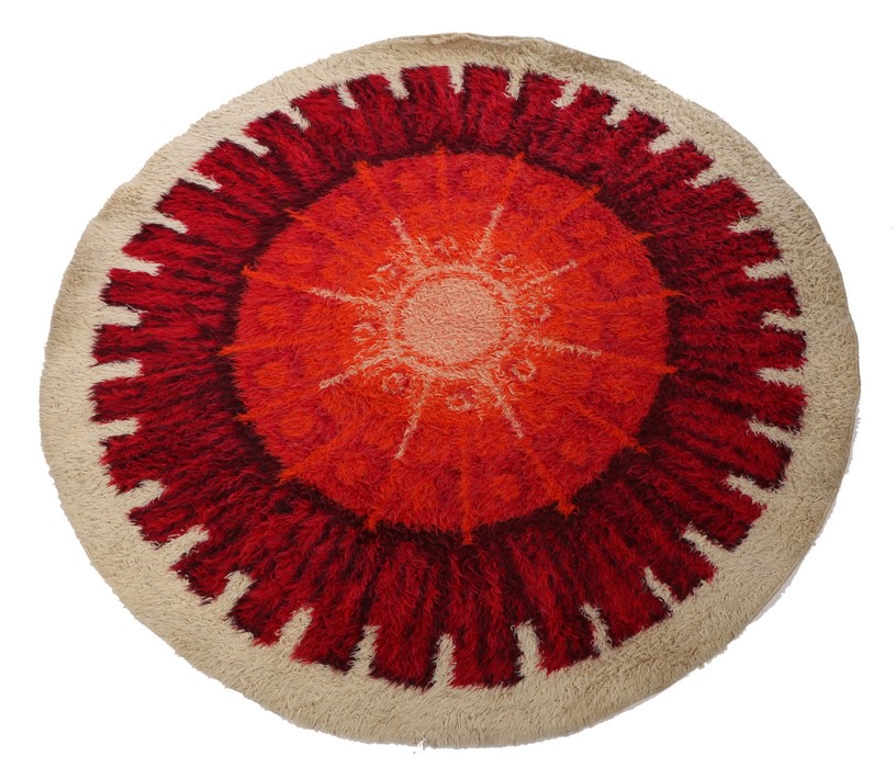 Mid 20th Century circular carpet, the cream ground with red and orange decoration, 198cm diameter