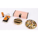 An orange & black Art Deco compact with matching tandem lipstick on a chain in original box, a