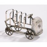 Edwardian novelty toast rack in the form of a car with four rotating wheels, 13cm wide