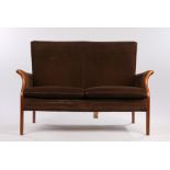 Parker Knoll two seat settee, upholstered in a brown velvet type material, with show wood arms, on