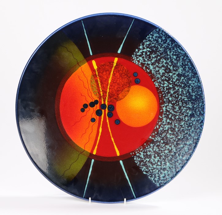 Alan Clarke studio hand painted plate, "Timeslip", the central field with orange, blue and red