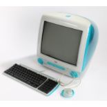 Apple iMac G3 desktop computer in Bondi Blue, with keyboard and mouse