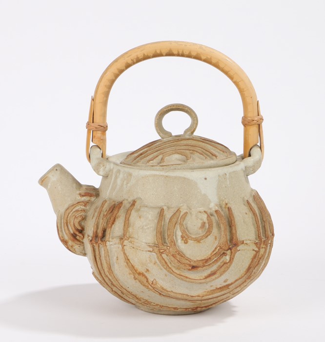 Bernard Rooke pottery teapot, with bamboo handle, the body with raised curving line decoration, 24cm