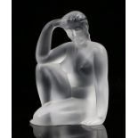 Lalique frosted glass figure, depicting a seated female nude with her right arm raised to her
