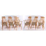 Set of twelve Ercol oak dining chairs, each with a tapered spindle back above curved arms and