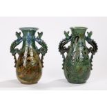 Near pair of C.H.Brannam Barum pottery vases, with twin-dragon handles, the body incised with