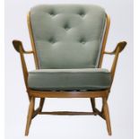 Ercol elm armchair, with fitted button back cushion and seat cushion, curved arms on turned