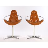 Pair of mid 20th Century swivel chairs, with brown leather button upholstered backs and seats,