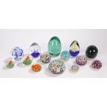 Collection of fourteen glass paperweights, to include four millefiori cane examples, two with