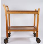 Staples & Co Ltd teak tea trolley, with two removable trays and turned wooden handle, 70cm wide,