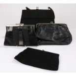 Four black leather vintage bags including an Italian soft leather clutch bag with a decorative clasp