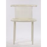 Helmut Lubke white elbow chair, with curved cresting rail, pierced comb back and circular seat, on