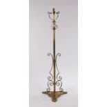 Arts and Crafts style standard lamp, converted from an oil lamp, with pierced scroll decoration,
