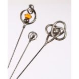 Three Charles Horner silver hat pins: a large twisted knot & ball design, Chester 1918, a small