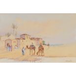 N. Preston, camels drinking at a desert oasis with buildings and figures to the rear, signed