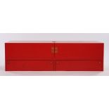 Japanese red lacquered cabinet, the top with hinged doors opening to reveal a black velvet lined