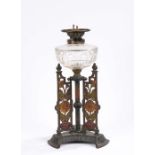 Youngs Duplex oil lamp, with clear glass reservoir, the cast base with urn form finials and