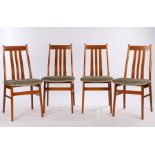 Four Farstrup Danish teak dining chairs, with pierced splat backs, overstuffed seats, on chamfered