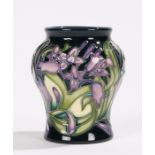 Moorcroft Isis pattern vase, the bulbous neck above a tapering body, with foliate decoration,