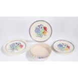 Three Poole pottery plates, shallow Poole pottery bowl, all with foliate decoration (4)