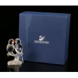 Swarovski figure depicting two parrots with green and blue tails, 8.5cm high, housed in a fitted