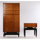 G-plan veneered chest of seven long drawers, raised on ebonised silhouette legs with brass effect