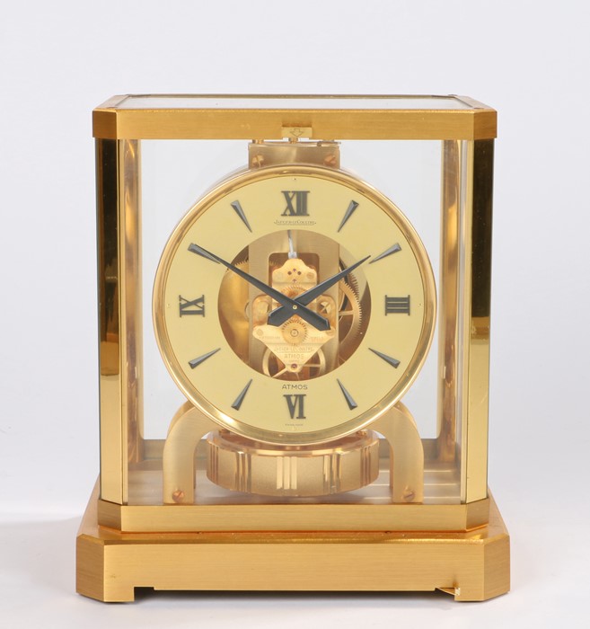 Jaeger Le Coultre Atmos clock, the white chapter ring with Roman and triangular numerals enclosing a