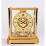 Jaeger Le Coultre Atmos clock, the white chapter ring with Roman and triangular numerals enclosing a