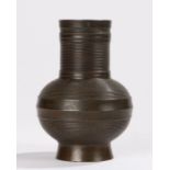 Late 19th Century Japanese bronze vase, the neck and bulbous body with ribbed decoration, stamped to