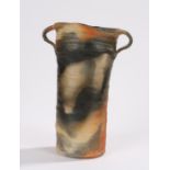 Janet Leach pottery vase, with loop handles to the oval rust stained body, seal marks to the lower