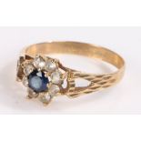 9 carat gold ring, with a sapphire set flower head design