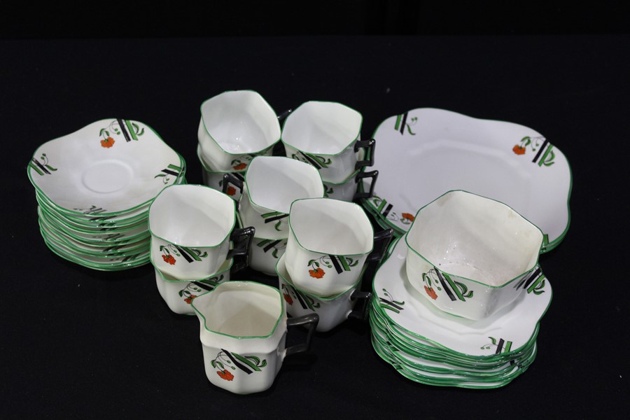 Fenton Paladin China tea service, with black and green bands and orange flower decoration on a white