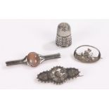 Silver jewellery, to include a ship brooch, a brooch another set with a stone and a thimble, (4)