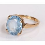 9 carat gold ring, with a faceted oval blue stone