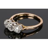 Diamond set ring, with three round cut diamonds to the head, the central diamond approximately 0.