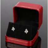 Pair of diamond set earrings, in the form of clovers set with five diamonds, 10mm high