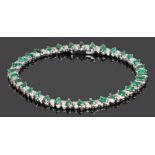 Diamond and emerald set bracelet, with a row of emeralds interspersed with diamonds, 18cm long