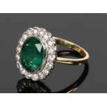 18 carat gold emerald and diamond set ring, the central emerald at 2.53 carats having a diamond