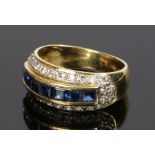 18 carat gold sapphire and diamond set ring, with a row of sapphire and diamond surround, ring