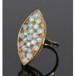 Gold and opal set marquise ring, with twenty-five opals to the head, stamped 750 and 375, ring
