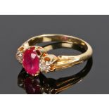 Burmese ruby and diamond set ring, the central oval cut Burmese ruby at 1.2 carat approximately with