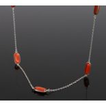 Coral necklace, with ten coral beads set to white metal, 92cm long