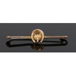 9 carat gold brooch, with a fox head and horse shoe to the bar, 48mm long